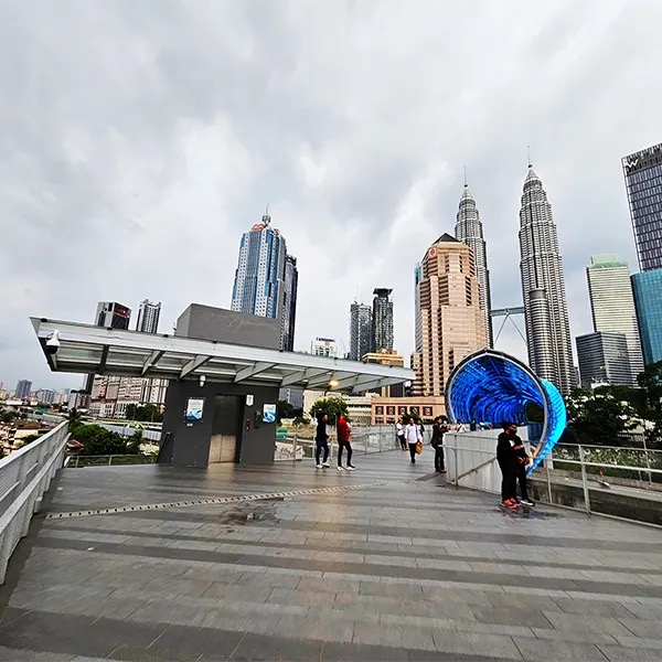 Open lawn in KLCC Park with Petronas towers visible