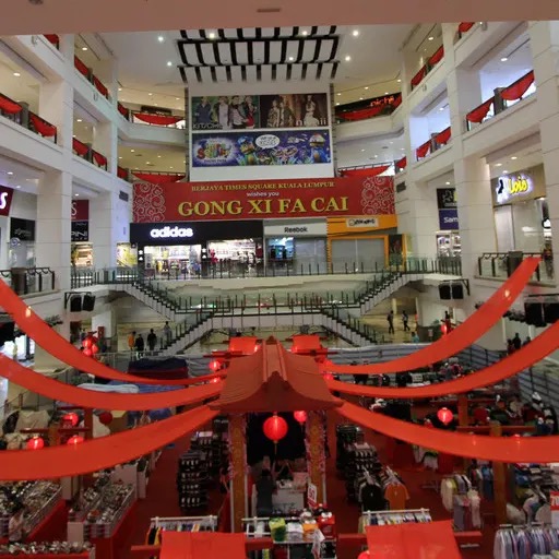 Shoppers walking through a Bukit Bintang mall interior