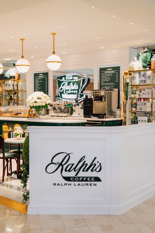 Wood and green seating nook inside Ralph's Coffee at Suria KLCC