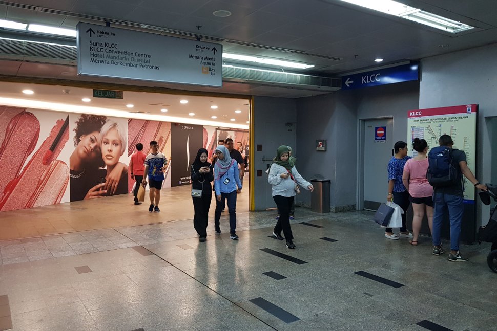 Signage inside the KLCC LRT station directing shoppers to Suria KLCC